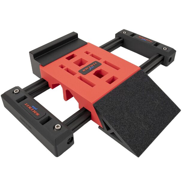 Adjustable red and black jig tool for precise drilling or woodworking.