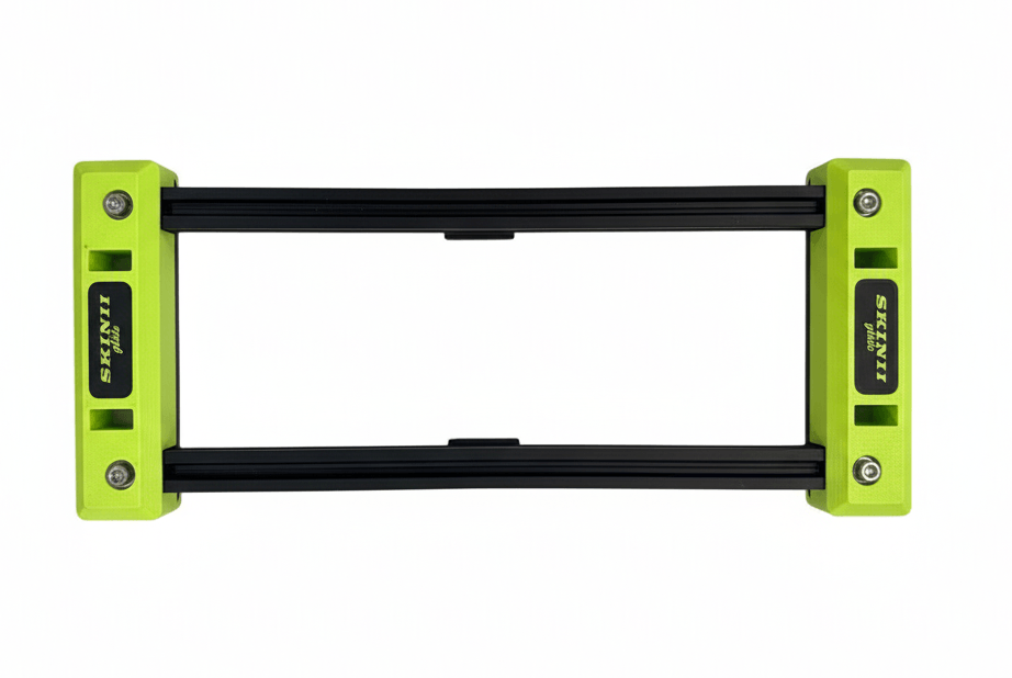 Green and black foam roller for muscle massage and therapy.